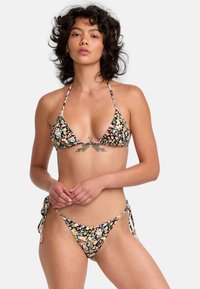 Black floral bikini featuring a triangle top with thin straps and a tie-side bottom, adorned with colorful, small flower patterns.