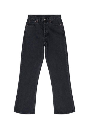 Musta farkut korkealla vyötäröllä, leveällä lahkeella, viiden taskun muotoilulla ja kuparinvärisillä yksityiskohdilla. Sisältää hienovaraisia ompeluyksityiskohtia.