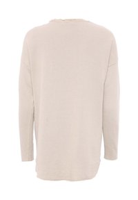 Pull à manches longues beige clair avec une coupe ample, doté d'un col brut et d'une texture côtelée, d'un ourlet droit et de fentes sur les côtés.