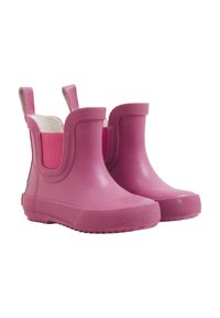 Botas de lluvia de goma rosa con suelas texturizadas, de altura media, laterales elásticos y lengüetas con lazos para facilitar su uso. Acabado liso.