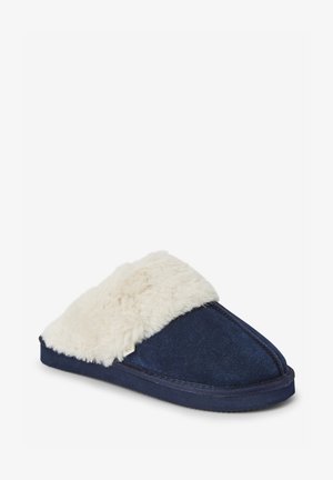 Navy blue slippers with a fluffy white faux fur collar, suede upper, and a durable sole for comfort and warmth.