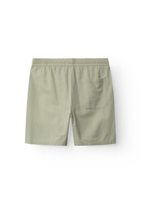 Světlé zelené plavky z texturovaného materiálu s elastickým pasem. Mají zadní kapsu.