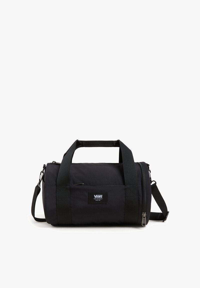 Black duffel bag with a cylindrical shape, made of durable fabric. Features dual handles, an adjustable shoulder strap, and a front zip pocket.