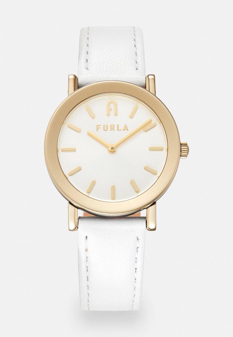 Guldtonet ur med hvid læderrem. Rund hvid urskive med guld timemarkører og mærkenavnet "FURLA" ved 12-tiden.
