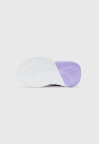 Sole of a white and lavender athletic shoe shown from the bottom, highlighting textured grip areas and curved tread patterns.