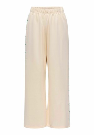 Beežid laiad püksid elastse vöökohtaga, millel on sirged rohelised dekoratiivsed aktsendid külgõmblustes, valmistatud siledast kangast.