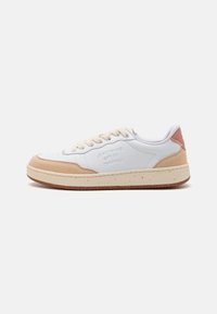 White leather sneakers with beige suede accents, round toe, beige laces, textured sole, and embossed branding on the side.
