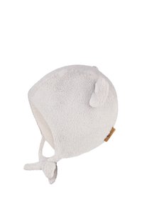 White, fluffy baby hat with rounded shape, small ears, and ties at the chin; made of soft material with a textured surface.