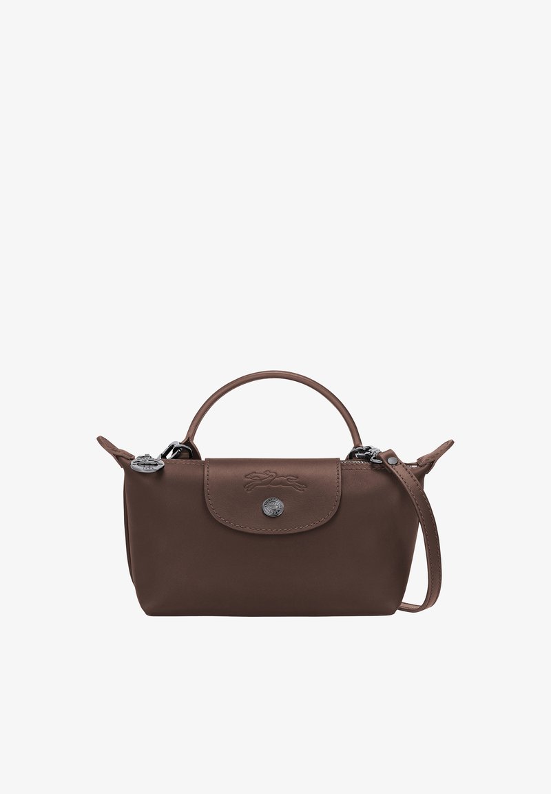 Small brown leather handbag with top handle, flap with button closure, embossed logo, and detachable shoulder strap.