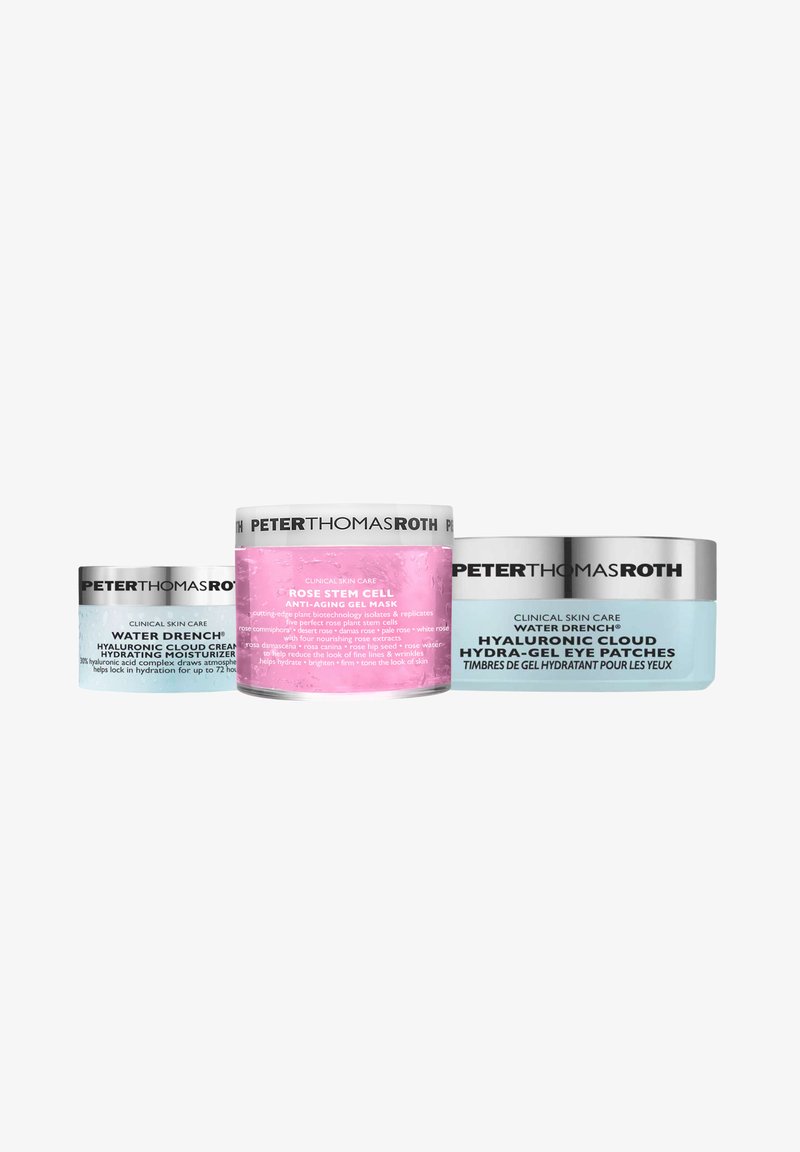 Three skincare products: a light blue jar, a pink gel mask jar, and a silver eye patch pack. All feature clear labels and modern designs.