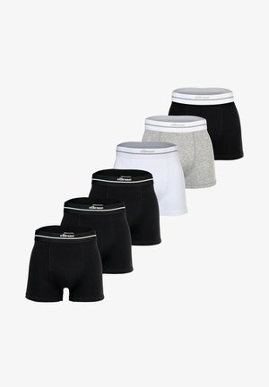 Sei paia di boxer da uomo in nero, bianco e grigio con fascia elastica con marchio, disposti in due file diagonali.