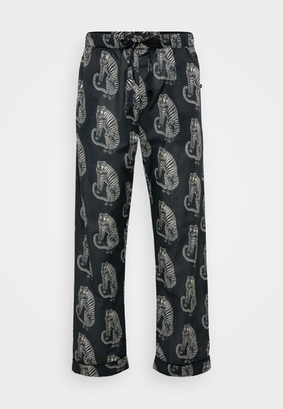 Mustat pyjamahousut, joissa on toistuva kuvio valkoisista ja harmaan värisistä tigreistä. Valmistettu pehmeästä kankaasta, jossa on joustava vyötärö ja naru.