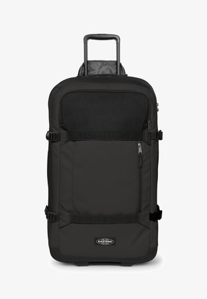 Zwarte rechthoekige zachte koffer met uitschuifbare handgreep, zijdelingse compressieriemen, ritssluiting van het voorvak en Eastpak-logo aan de voorkant.