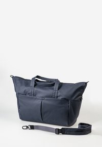 Navyblaue Tragetasche aus robustem Material, ausgestattet mit zwei Vordertaschen, zwei Griffen und einem verstellbaren Schultergurt.