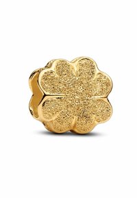 Charm a forma di fiore in oro con superficie testurizzata e finitura lucida, con petali sovrapposti e un centro aperto per l'infilatura.