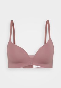 Lys rosa trådløs BH med en glatt overflate, dyp utringning og justerbare stropper. Har en myk kant for komfort.