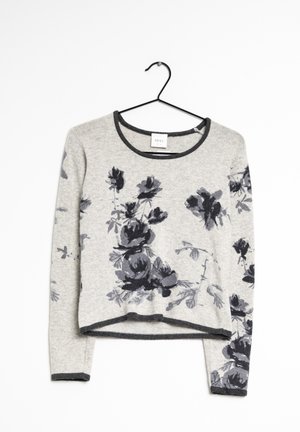Light grey knit sweater with black floral pattern, round neckline, long sleeves, and a slightly cropped hem; features dark trim accents.