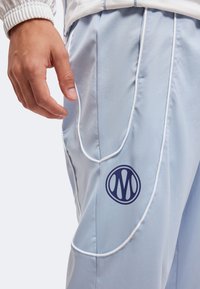 Puma OLYMPIQUE MARSEILLE PUMATECH-X TRACK PANT WV - Ρούχα για κλαμπ - snow mountain blue/blue crystal