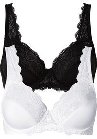 Bras in pizzo bianco e nero con bordi ondulati, caratterizzati da coppe in pizzo nero e base in cotone bianco, che offrono texture e design a contrasto.