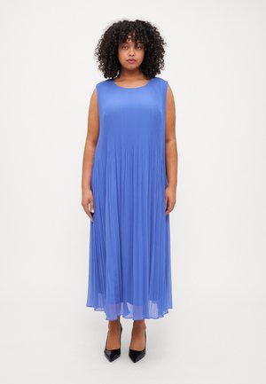 Sleeveless blue pleated dress with a round neckline, flowing to mid-calf, made of lightweight fabric. Black pointed heels complete the look.