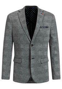 Grå texturerad blazer med rutmönster, enkel knappstängning och en fickfyrkant. Fodrad med ett kontrasterande mönstrat inre.