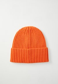 Orange knitted beanie hat with a ribbed texture and folded cuff, designed for warmth and comfort.