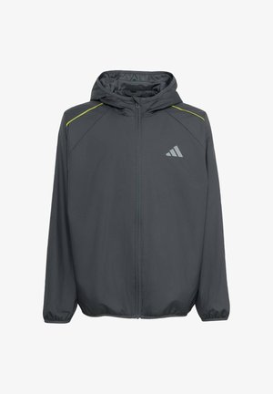 Dunkelgraue Jacke mit Reißverschluss und Kapuze, elastischen Bündchen, kleinem reflektierendem Logo auf der Brust und dünnen gelben Streifen auf den Schultern.