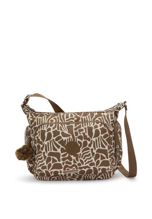 Braune und cremefarbene Schultertasche mit Muster, einem Reißverschluss-Hauptfach, einer Fronttasche und braunem Riemen. Mit einem pelzigen Anhänger versehen.