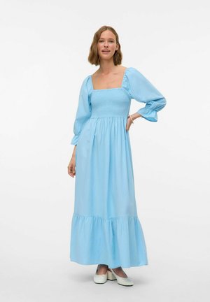 Light blue maxi dress with a square neckline, smocked bodice, puff sleeves, and a ruffled hem. Smooth fabric and airy design.