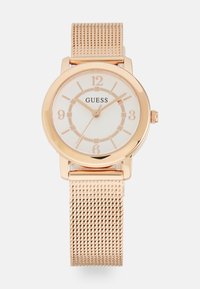 Roségoldene Uhr mit rundem Gehäuse, weißem Zifferblatt und Mesh-Armband. Verfügt über große Stundenmarkierungen und eine kleine Krone an der Seite.