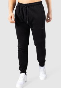 Smilodox TAYLOR - Trainingsbroek - schwarz