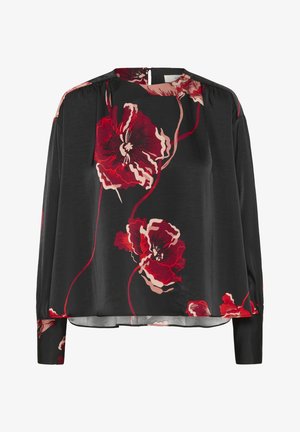 Blouse noire à manches longues avec un imprimé floral rouge et rose, décolleté rond et fermeture à boutons à l'arrière.
