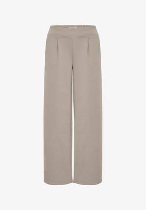 Platām kājām bikses gaiši bēšā krāsā, ar elastīgu jostu, gludu audumu un divām priekšējām krokām papildu detaļām.