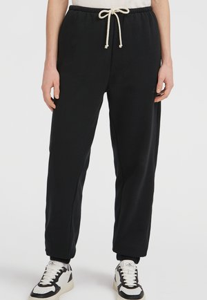 Zwarte sweatpants met een relaxte pasvorm, gemaakt van zachte katoen. Ze hebben een elastische tailleband met een trekkoord en ribgebreide boorden.