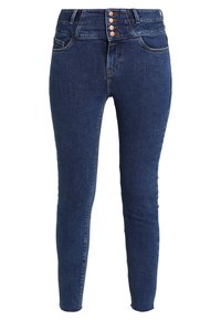 Jeans ajustados de cintura alta en denim azul oscuro. Presentan cuatro botones metálicos, estilo clásico de cinco bolsillos y una textura suave.