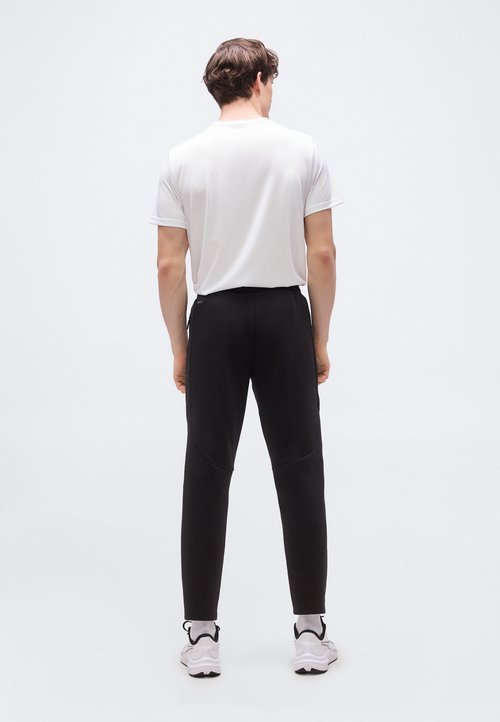 PUMA EVOSTRIPE PANTS - Tracksuit bottoms - black — photo 3