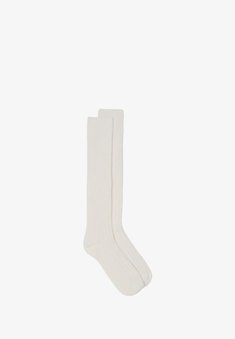 Cremfarbene kniehohe Socken mit gerippter Textur, aus weichem Material gefertigt. Verfügt über einen glatten oberen Rand ohne sichtbare Beschläge oder Muster.