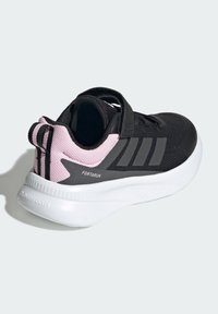 Black athletic shoe with pink accents, breathable mesh upper, gray stripes, padded collar, and white Cloudfoam midsole. Adjustable strap closure.