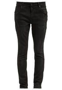 Jean noir slim avec des patches usés sur l'avant des cuisses et des genoux, doté de poches avant, passants de ceinture et fermeture à boutons.