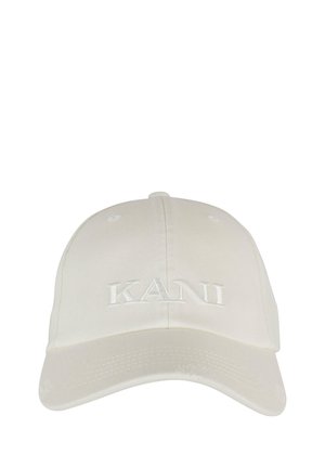 White baseball cap made of cotton with a curved visor and embroidered "KANI" on the front. Features ventilation holes above the crown.