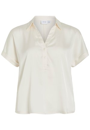 Lühikeste varrukatega kreemikas pluus V-kaelusega, nööpide rühm ja klassikalise kraega, valmistatud siledast kangast.