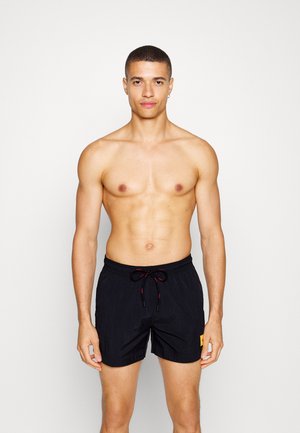 DOMINICA - Swimming shorts - black