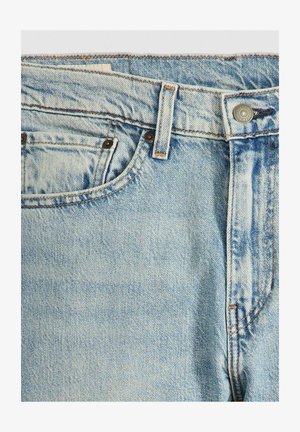 Light blue denim jeans with a classic five-pocket design, featuring copper hardware, tonal stitching, and a soft, slightly worn texture.