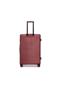 Hartschalenkoffer in Bordeauxrot mit gerippter Textur, schwarzem Teleskopgriff und vier Rädern für Mobilität.