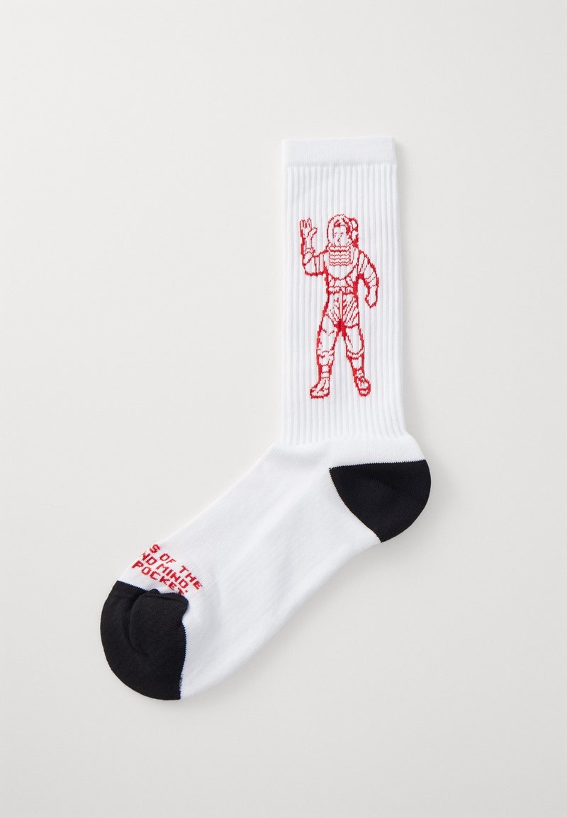 White cotton socks featuring a red embroidered astronaut design. Black accents at the toe and red text on the sole. Vertical ribbed texture.