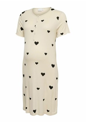 Robe courte crème avec motifs de cœurs noirs, manches courtes, encolure ronde et patte de boutonnage à l'avant.