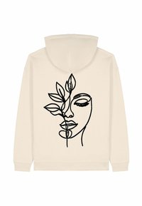 Felpa crema in misto cotone, con un disegno a linea nera di un volto intrecciato con foglie sul retro. Design semplice e minimalista.