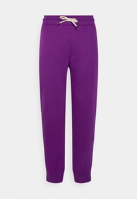 Lila Jogginghose aus weichem Stoff, mit einem Tunnelzugbund und beigefarbenen Kordeln, Bündchen am Saum und lockerer Passform.