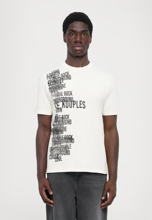 Short-sleeve, crew-neck t-shirt in cream cotton with contrasting black text design featuring various words arranged vertically on one side.