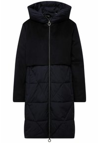 Lång pufferjacka med övre del i svart fleece och nedre del i kviltad nylon, med hög krage, mittdragkedja och en rund draggrepp.